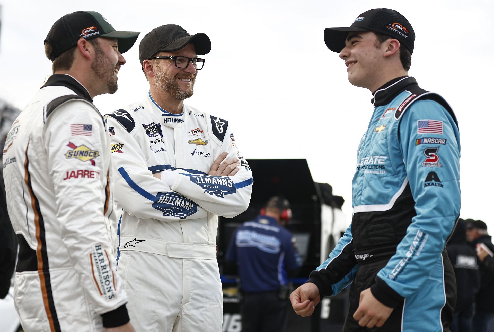 Dale Earnhardt Jr. (C) speaks with Josh Berry (L) and Sam Mayer (R) at Martinsville. Source: Getty